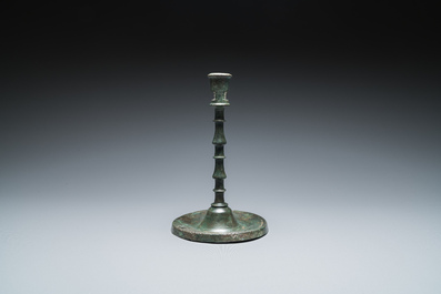 A Dutch or Flemish knotted bronze candlestick, 15th C.