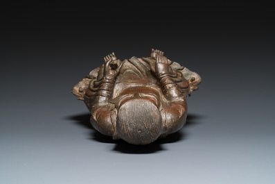 Een Chinese bronzen Zhen Wu met sporen van lakwerk, Ming