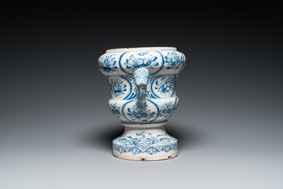 A large blue and white two-handled Frisian Delftware jardini&egrave;re with dolphin handles, Makkum, 18th C.