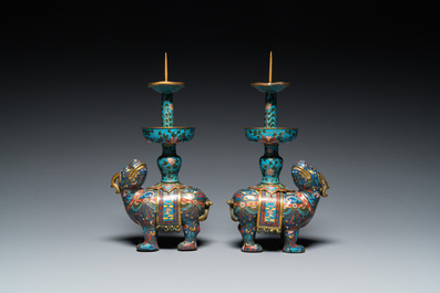 A pair of Chinese cloisonn&eacute; candlesticks in the shape of pixiu, Qing