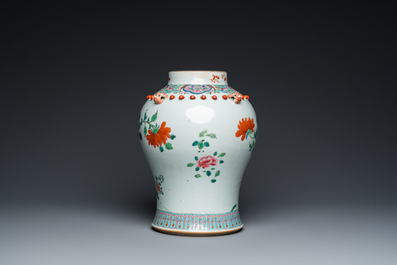A Chinese famille rose vase with wooden cover, 19th C.