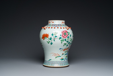 A Chinese famille rose vase with wooden cover, 19th C.