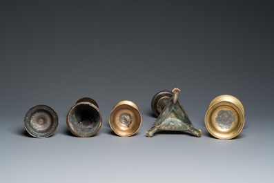 Five brass and bronze candlesticks, 16th C. and later