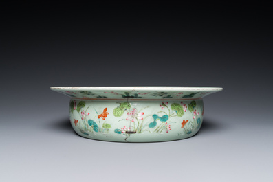 A Chinese famille rose celadon-ground 'carps' basin, 19th C.