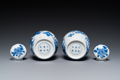 A pair of Chinese Canton famille rose vases and a pair of blue and white covered jars, 19th C.