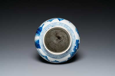 A Chinese blue and white 'Mongolian hunt' jar with wooden cover, Kangxi