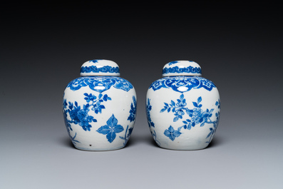 A pair of Chinese Canton famille rose vases and a pair of blue and white covered jars, 19th C.