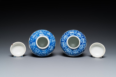 A pair of Chinese Canton famille rose vases and a pair of blue and white covered jars, 19th C.