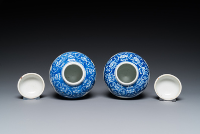 A pair of Chinese Canton famille rose vases and a pair of blue and white covered jars, 19th C.