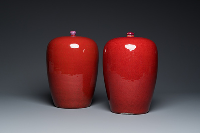 A pair of Chinese sang-de-boeuf-glazed covered jars, 19th C.