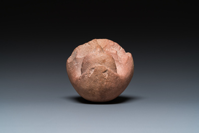 An Egyptian light brown limestone canopic lid in the shape of a falcon head, Late Period