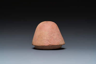 An Egyptian light brown limestone canopic lid in the shape of a falcon head, Late Period