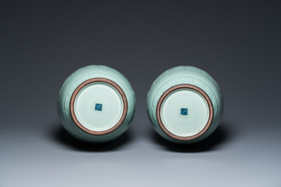 A pair of Chinese monochrome celadon-glazed vases with underglaze design on wooden stands, Qianlong mark, 18/19th C.