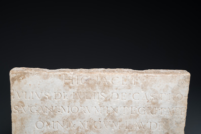 A marble tomb stone in Roman style, dated 1660