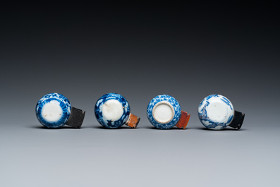Four Chinese blue, white and copper-red bird feeders, 19th C.