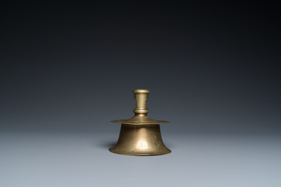 A Flemish brass capstan candlestick, 16th C.