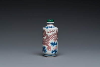 A Chinese blue, white and copper-red 'dragon' snuff bottle, Yongzheng mark, 19th C.