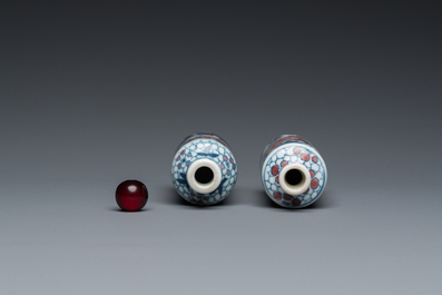 Two Chinese blue, white and copper-red snuff bottles, Yongzheng mark, 19th C.