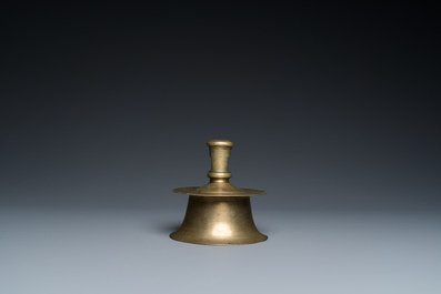 A Flemish brass capstan candlestick, 16th C.