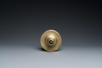 A Flemish brass capstan candlestick, 16th C.