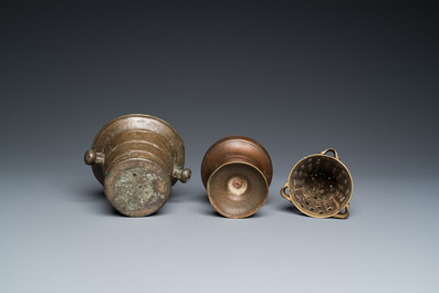 A bronze mortar, a censer and two pax of which one gilded, Western Europe, 16/17th C.
