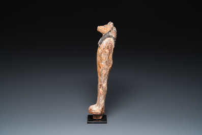 An Egyptian stucco painted wooden mummiform figure of Anubis, New Kingdom