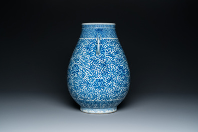 A Chinese blue and white 'hu' vase with lotus scrolls, Qianlong mark, 19th C.