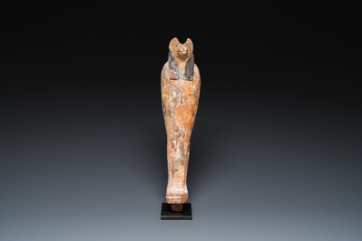 An Egyptian stucco painted wooden mummiform figure of Anubis, New Kingdom