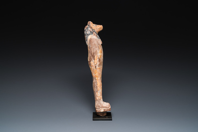 An Egyptian stucco painted wooden mummiform figure of Anubis, New Kingdom