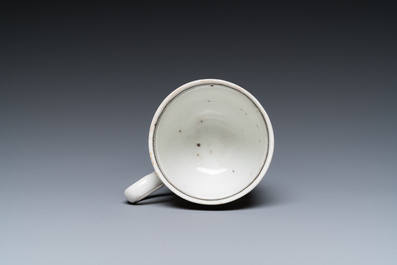 A rare Chinese gilt, grisaille and iron-red cup and saucer with a merchant vessel, Yongzheng/Qianlong