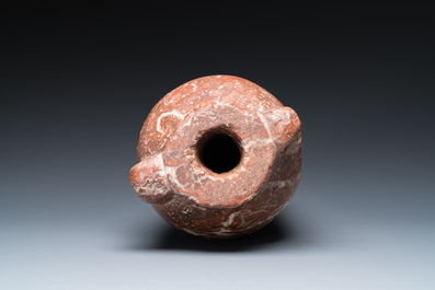 An Egyptian red Breccia jar, Predynastic period, 3500-2900 b.C.