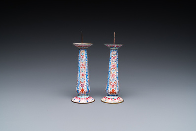 A pair of Chinese Canton enamel candlesticks, Yongzheng/Qianlong