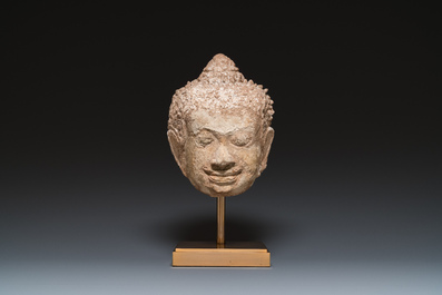 A large Thai stucco head of Buddha, Haripunchai region, 13th C.