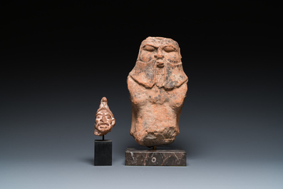 A Roman terracotta sculpture of the god Bes and a grotesque head of a male, ca. 1st C.