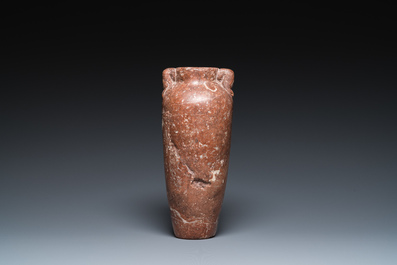 An Egyptian red Breccia jar, Predynastic period, 3500-2900 b.C.