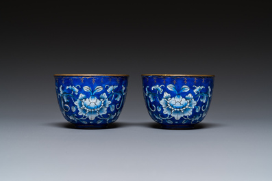 A pair of Chinese Canton enamel trembleuse cups on stands with double 'Shou' design, Qianlong