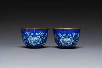 A pair of Chinese Canton enamel trembleuse cups on stands with double 'Shou' design, Qianlong