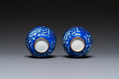 A pair of Chinese Canton enamel trembleuse cups on stands with double 'Shou' design, Qianlong
