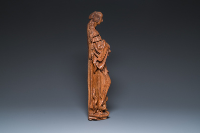 A Flemish carved oak sculpture of a female saint on a pyre, Brabant region, first half 16th C.