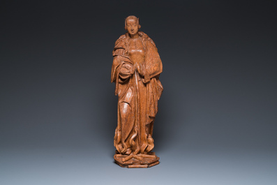 A Flemish carved oak sculpture of a female saint on a pyre, Brabant region, first half 16th C.