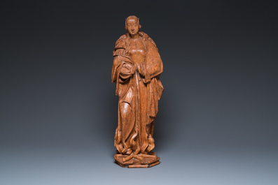 A Flemish carved oak sculpture of a female saint on a pyre, Brabant region, first half 16th C.