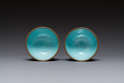 A pair of Chinese Canton enamel trembleuse cups on stands with double 'Shou' design, Qianlong