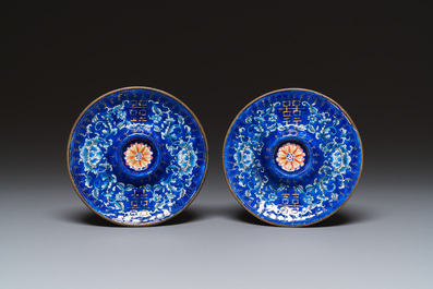 A pair of Chinese Canton enamel trembleuse cups on stands with double 'Shou' design, Qianlong