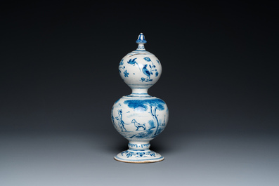 A Dutch Delft blue and white double gourd money bank with a deer hunt, dated 1732