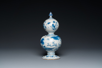 A Dutch Delft blue and white double gourd money bank with a deer hunt, dated 1732