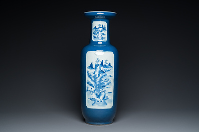 A Chinese blue-ground rouleau vase with blue and white landscape panels, 19th C.