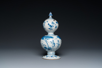 A Dutch Delft blue and white double gourd money bank with a deer hunt, dated 1732