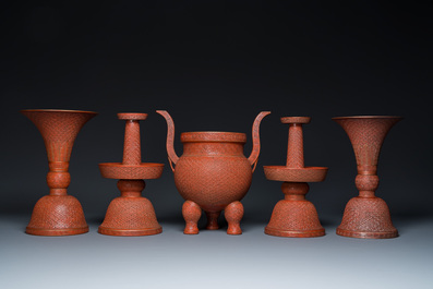 A Chinese faux-lacquered five-piece altar garniture, Qianlong mark, 19th C.