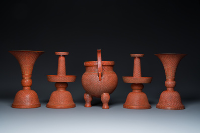 A Chinese faux-lacquered five-piece altar garniture, Qianlong mark, 19th C.