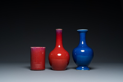 Two Chinese monochrome sang-de-boeuf and powder-blue-glazed vases and a brush pot, 18/19th C.